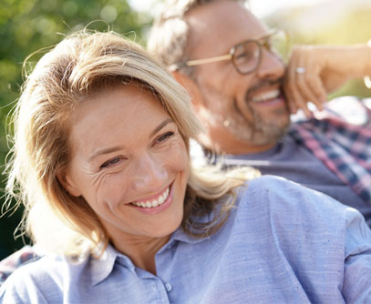 Smiling older couple relaxing outdoors